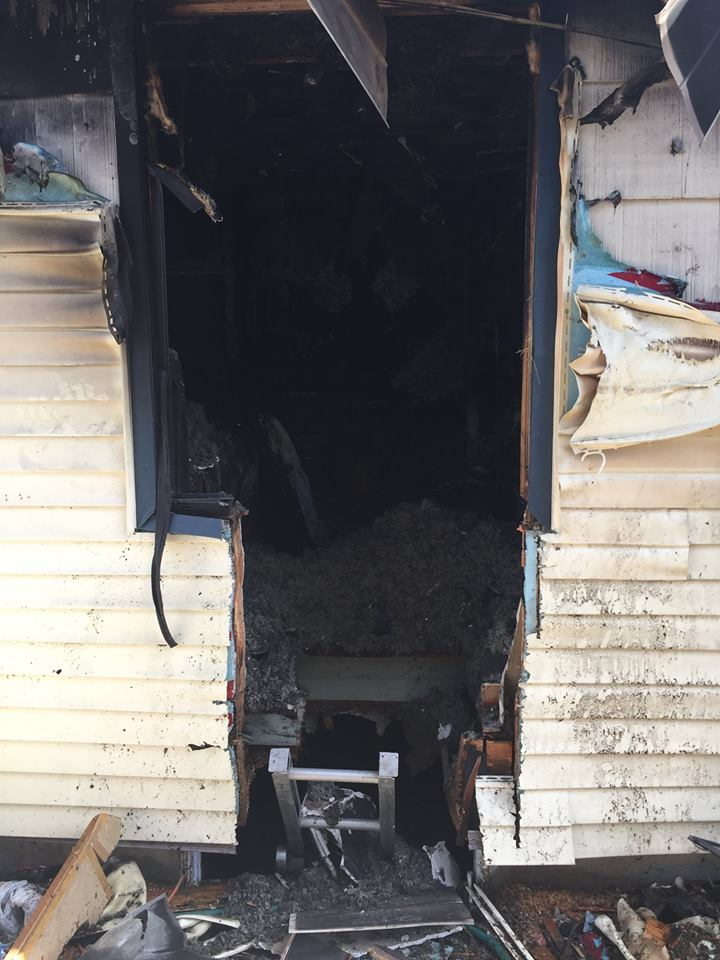 Spokane firefighters could see the man's face and arms, but he was unable to escape through the small window. They enlarged the opening and then cut a hole in the basement floor.
