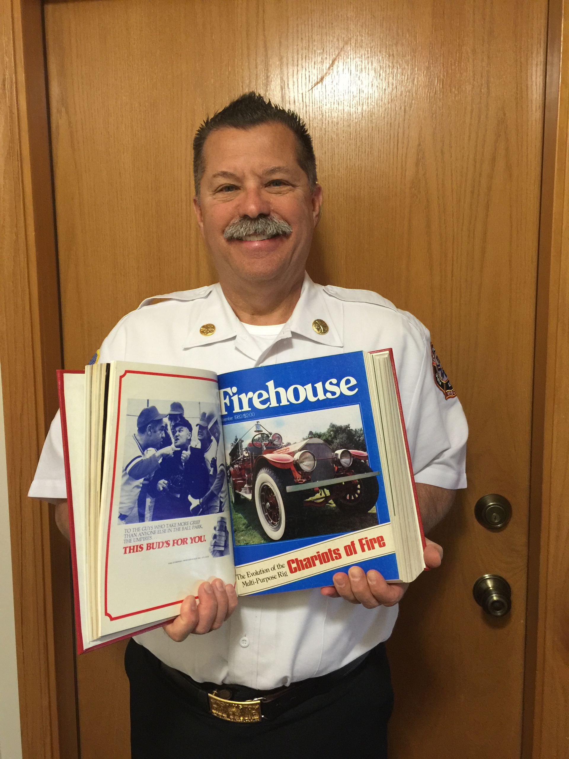 Chief Rubin holding a copy of the November 1982 issue of Firehouse in which his first article appeared.