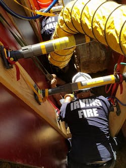 Firefighters secured the worker while they removed dirt from the collapsed trench. Firefighters secured the worker while they removed dirt from the collapsed trench.