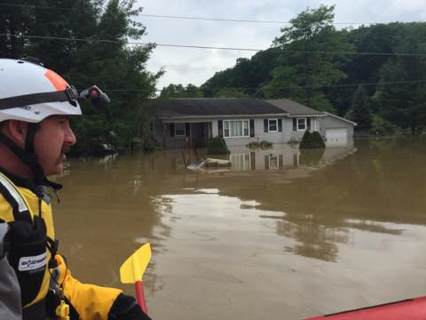 A Bristol, VA firefighter looks for victims and surveys the damage.