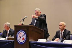 Austin speaking at a conference.