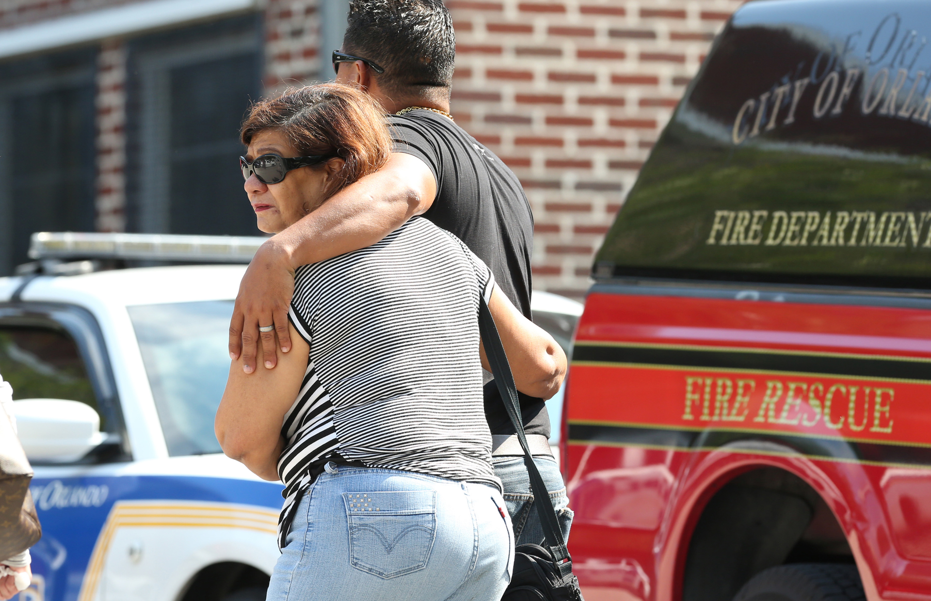 People are consoled as they learn the names of the victims.