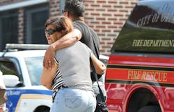 People are consoled as they learn the names of the victims. People are consoled as they learn the names of the victims.