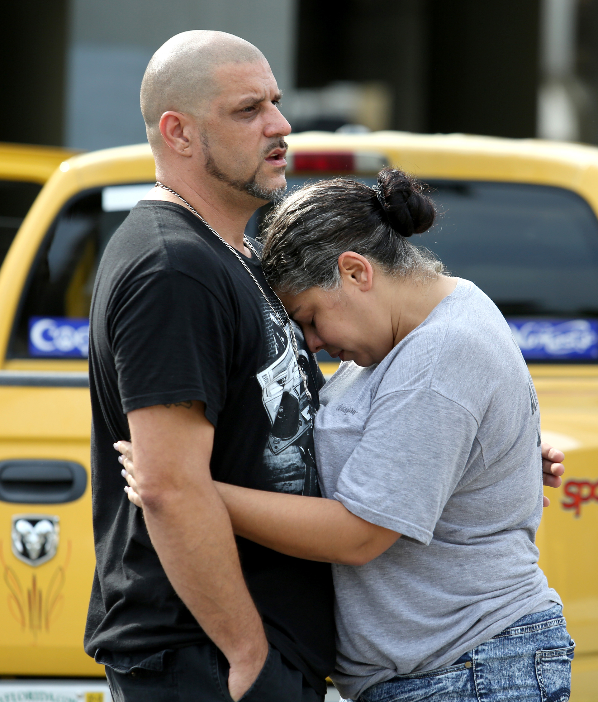 Ray Rivera, DJ at the Pulse nightclub, is consoled by a friend outside of the Orlando Police Department on Sunday, June 12, 2016.