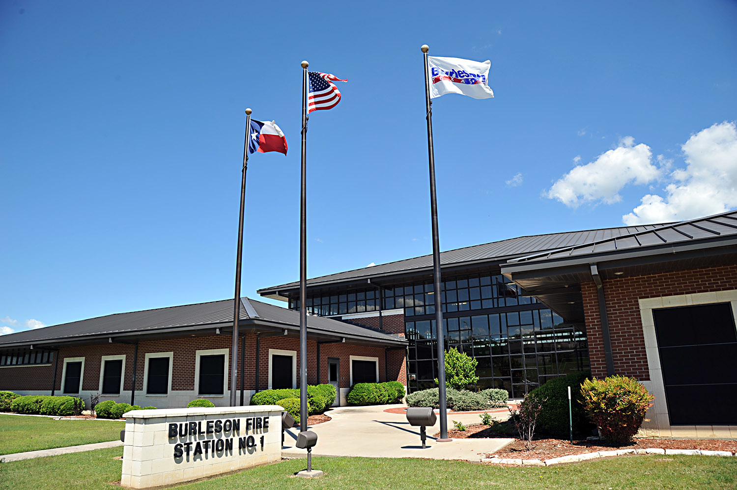 A view of the station includes ground to roof windows from the street.