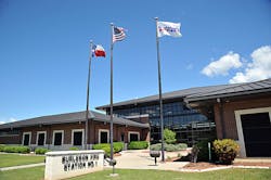 A view of the station includes ground to roof windows from the street. A view of the station includes ground to roof windows from the street.