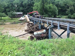 Debris like this piles up at bridges. The propane tanks were removed. Debris like this piles up at bridges. The propane tanks were removed.