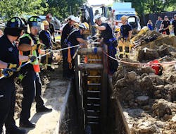 The patient is removed from the trench after being secured to backboard. The patient is removed from the trench after being secured to backboard.