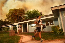 Seth Moberg, 16, gathers belongings from his family's house as the Sand fire approaches in Santa Clarita, Calif., on Saturday, July 23, 2016. Seth Moberg, 16, gathers belongings from his family's house as the Sand fire approaches in Santa Clarita, Calif., on Saturday, July 23, 2016.