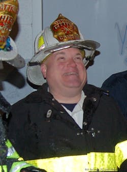 Paul Price, who died on Aug. 10, photographed at a fire while he was a deputy chief in Camden, NJ.