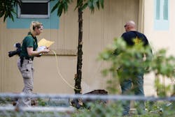 Investigators with the St. Lucie County Sheriff's Office work in a yard Monday, Sept. 12, 2016 at the Fort Pierce Islamic Center after an apparent arsonist started a fire at the back of the center earlier that morning in Fort Pierce, Fla. Investigators with the St. Lucie County Sheriff's Office work in a yard Monday, Sept. 12, 2016 at the Fort Pierce Islamic Center after an apparent arsonist started a fire at the back of the center earlier that morning in Fort Pierce, Fla.