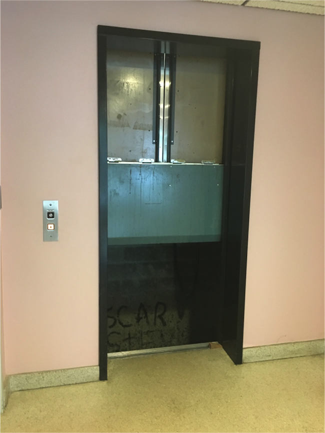 Figure 1: An elevator is stuck at a point between the second and third floor where you may be able to have to the three people climb down and out on a ladder to the second floor or up and out to the floor above via a ladder.