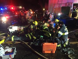 Clackamas firefighters provide efforts to resuscitate the man rescued from the Oregon City apartment building.