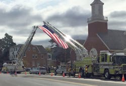 The Slatington ladder truck (left) was requested by a neighboring fire department to help fly an American flag at a funeral.