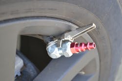 Use of a ball tire air chuck with a valve stem lock-on clip allows the device to attach to the valve stem as it allows air to escape from the tire.