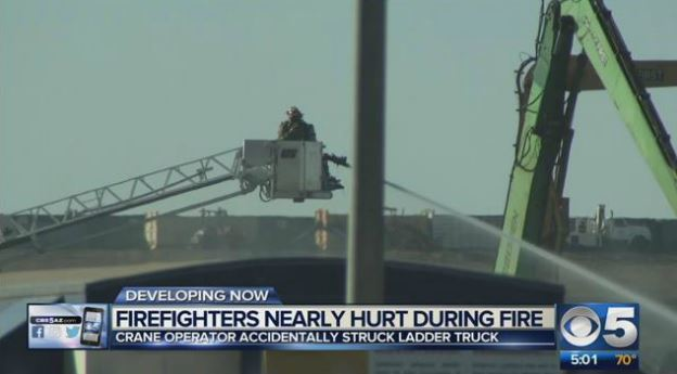 Phoenix firefighters were operating in an aerial ladder bucket when it was struck by a crane.