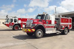 Dry agent quick response ARFF unit in the foreground and ARFF foam crash truck in the background. Dry agent quick response ARFF unit in the foreground and ARFF foam crash truck in the background.