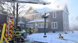 Size-up revealed occupants of apartments were evacuating from the rear. Smoke was noted on both aboveground levels of the structure in the rear but not a large volume. The fire was deemed an offensive attack and preparations were made for entry into the basement.
