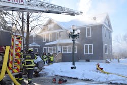 Size-up revealed occupants of apartments were evacuating from the rear. Smoke was noted on both aboveground levels of the structure in the rear but not a large volume. The fire was deemed an offensive attack and preparations were made for entry into the basement.