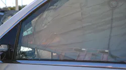 The driver’s door-window glass on this 2017 Chevrolet Tahoe is laminated safety glass. During your window size-up, telltale signs that you must look for include the large cracks in the glass. These stress cracks indicate that that you are dealing with laminated glass, not tempered glass.