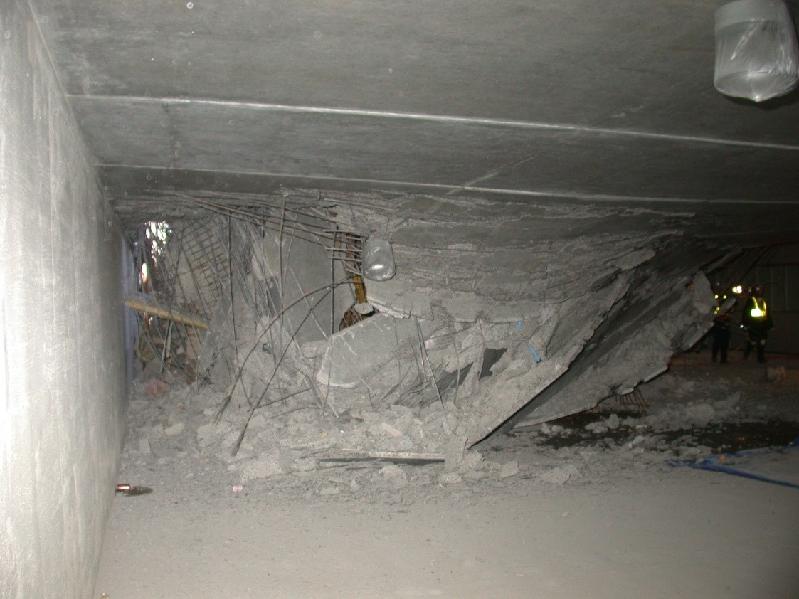 Photo 1. Rescuers will have to manipulate their way through the debris to access voids created by the collapse.
