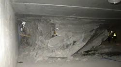 Photo 1. Rescuers will have to manipulate their way through the debris to access voids created by the collapse.