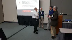 Gathering before a class on the international perspective on firefighter toxic exposures were, left to right Bruce Varner, a representative of The Institution of Fire Engineers, class presenter, Dr. Stefan Svensson, class presenter Dr. Gavin Horn and Ed Hardin, also of The Institution of Fire Engineers.