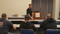 Jesse Quinalty, a captain with the Upland, CA, Fire Department and co-founder of Red Helmet Training. makes a point during his SLAB SAVERS presentation at Firehouse World in San Diego.