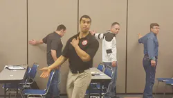 Milwaukee Fire Department Capt. Jordan Ponder teaches a group of firefighters some simple flexing exercises to help strengthen shoulder muscles during a class at Firehouse World. Milwaukee Fire Department Capt. Jordan Ponder teaches a group of firefighters some simple flexing exercises to help strengthen shoulder muscles during a class at Firehouse World.