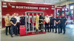Ram Air Gear Dryer Director of Sales David Adams (left) presents a Ram Air 4-MU Gear Dryer from the Hometown Heroes contest to Northshore Fire Department staff in Kenmore, WA.