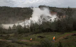 PG&E crews work to move two electric transmission line towers as a precaution should the Oroville Dam emergency spillway need to be used on Friday, Feb. 10, 2017 in Oroville, Calif. PG&E crews work to move two electric transmission line towers as a precaution should the Oroville Dam emergency spillway need to be used on Friday, Feb. 10, 2017 in Oroville, Calif.