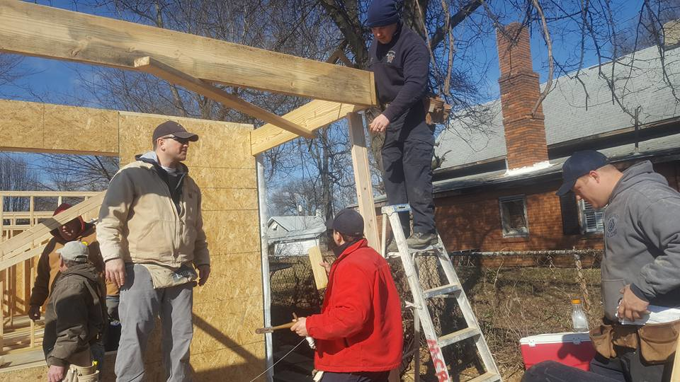 Henderson firefighters spent two weeks working with Habitat for Humanity of Henderson to build a house where a 2008 fire claimed a woman's life.