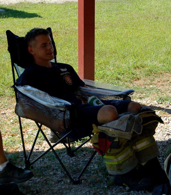 Forearm cooling consisted of a collapsible chair with water immersion troughs built into the arm rests. (All photos reprinted with permission from Yeargin, S, McKenzie, AL, Eberman, LE, et al. Physiological and perceived effects of forearm or head cooling during simulated firefighting activity and rehabilitation. J Athl Train. 2016;51(11):927-935.)