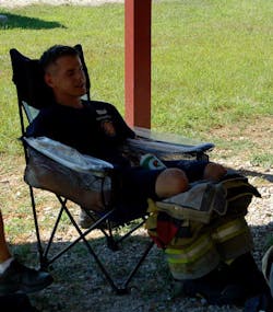 Forearm cooling consisted of a collapsible chair with water immersion troughs built into the arm rests. (All photos reprinted with permission from Yeargin, S, McKenzie, AL, Eberman, LE, et al. Physiological and perceived effects of forearm or head cooling during simulated firefighting activity and rehabilitation. J Athl Train. 2016;51(11):927-935.)