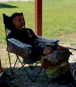 Forearm cooling consisted of a collapsible chair with water immersion troughs built into the arm rests. (All photos reprinted with permission from Yeargin, S, McKenzie, AL, Eberman, LE, et al. Physiological and perceived effects of forearm or head cooling during simulated firefighting activity and rehabilitation. J Athl Train. 2016;51(11):927-935.) Forearm cooling consisted of a collapsible chair with water immersion troughs built into the arm rests. (All photos reprinted with permission from Yeargin, S, McKenzie, AL, Eberman, LE, et al. Physiological and perceived effects of forearm or head cooling during simulated firefighting activity and rehabilitation. J Athl Train. 2016;51(11):927-935.)