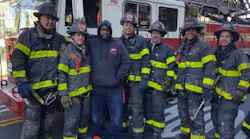 Ubeaka McKinney, third from left, was rescued from a burning building by firefighters from Ladders 120 and 176.