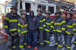 Ubeaka McKinney, third from left, was rescued from a burning building by firefighters from Ladders 120 and 176. Ubeaka McKinney, third from left, was rescued from a burning building by firefighters from Ladders 120 and 176.