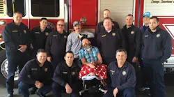 Houston firefighters surround Capt. Bill 'Iron' Dowling for a group photo last year.