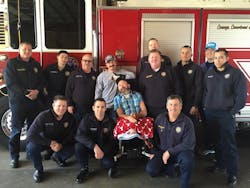 Houston firefighters surround Capt. Bill 'Iron' Dowling for a group photo last year. Houston firefighters surround Capt. Bill 'Iron' Dowling for a group photo last year.