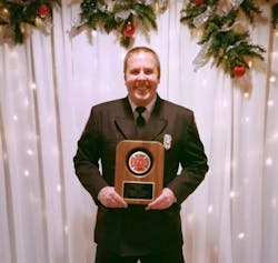 Firefighter/Paramedic Justin Root proudly displays his 2016 Rookie of the Year Award. Firefighter/Paramedic Justin Root proudly displays his 2016 Rookie of the Year Award.