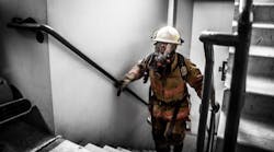 Tim Sendelbach makes his way up the stairs in the 69-story building.