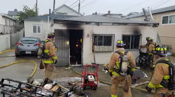 San Diego firefighters remain on scene after containing a house fire in March.