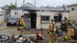 San Diego firefighters remain on scene after containing a house fire in March. San Diego firefighters remain on scene after containing a house fire in March.