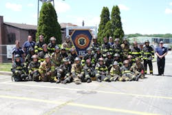 Junior firefighters and Explorers from the Fahrenheit 516! program pose for a group photo after a week of training, education and relationship building. Junior firefighters and Explorers from the Fahrenheit 516! program pose for a group photo after a week of training, education and relationship building.