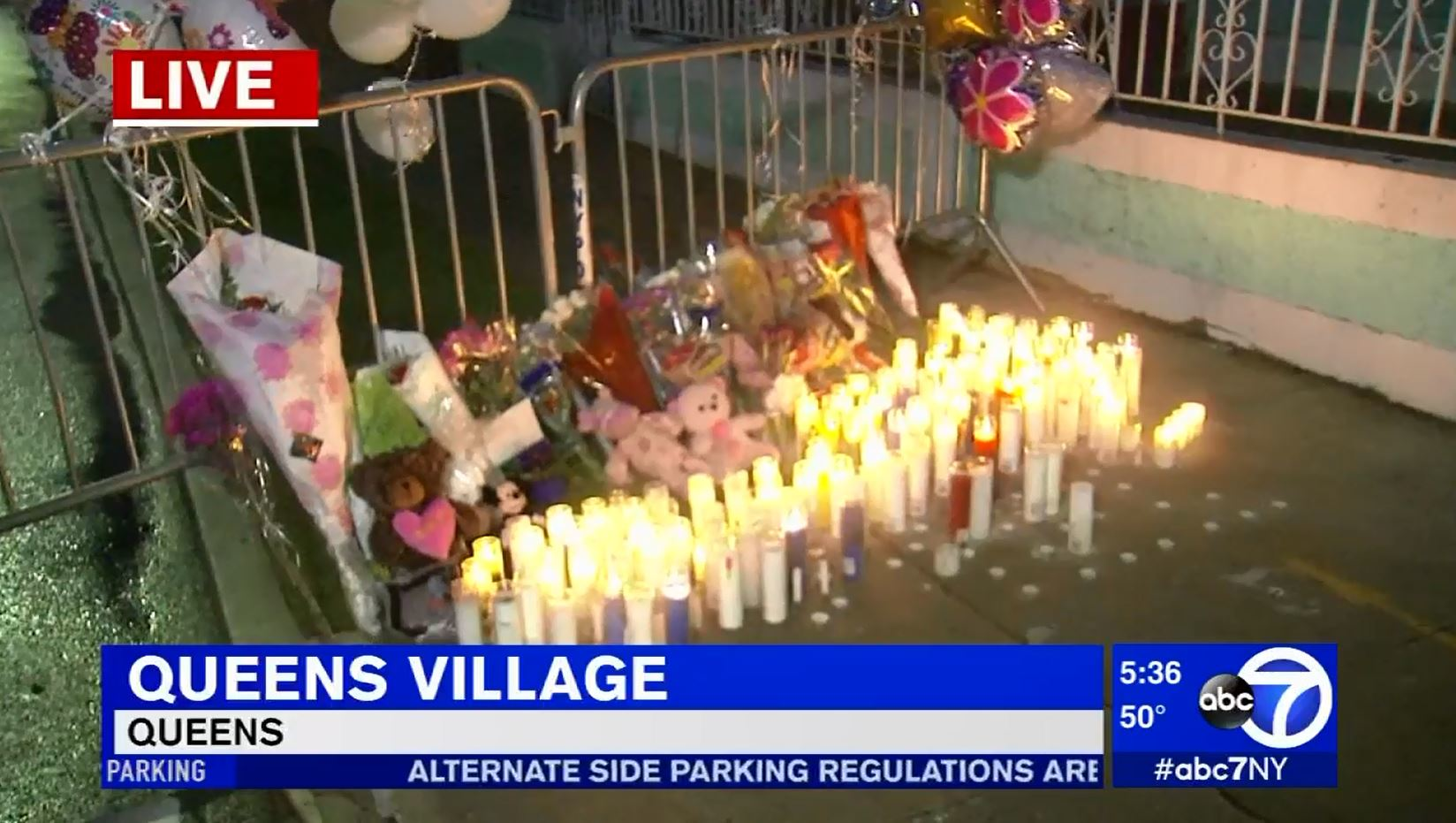 A makeshift memorial is set up in front of a Queens home where five people died in a fire Sunday.