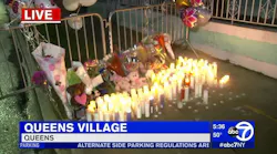 A makeshift memorial is set up in front of a Queens home where five people died in a fire Sunday.