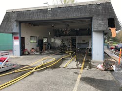 Firefighters assess damage after early morning fire in attic space at Fire Station 19 in Damascus, OR.