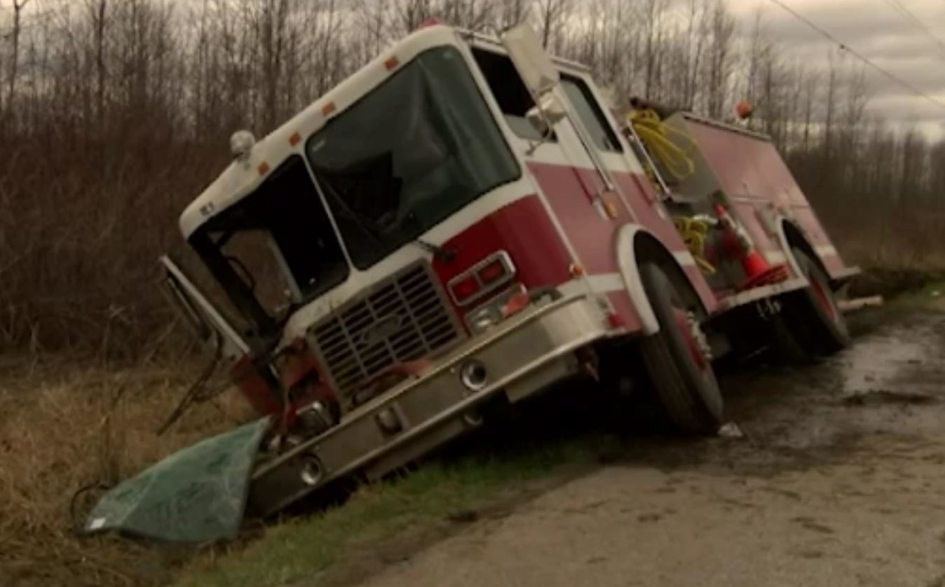 A fire truck sits in a ditch after a crash that injured two Vermont firefighters.