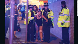 An injured concert-goer is helped by police and emergency responders on Monday, May 22, 2017 at the Manchester Arena in Manchester, England after a suicide bombing. An injured concert-goer is helped by police and emergency responders on Monday, May 22, 2017 at the Manchester Arena in Manchester, England after a suicide bombing.
