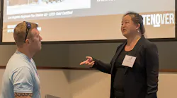 Candice Wong talks with a Station Design Conference attendee following her session on green and LEED fire stations.